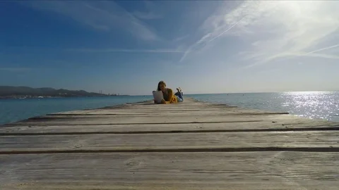 Woman lying on pier Stock Footage