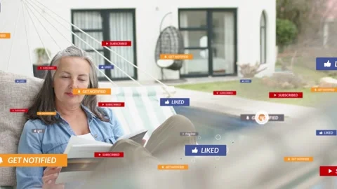 Woman lying reading in pool hammock, social alerts clustering around her to Stock Footage 333529018