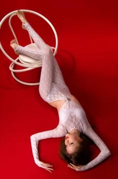 Woman lying on a red floor Stock Photos