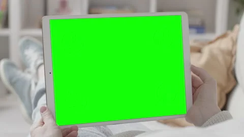 Woman Lying on Sofa with Tablet Computer in Hands Stock Footage 151006705