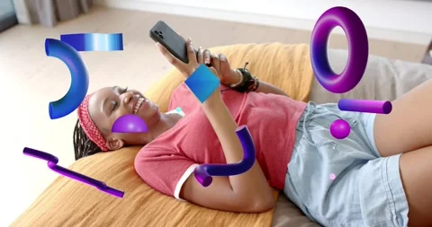 Woman lying on sofa tapping phone causing 3D shapes drifting between camera and Stock Footage 320895762