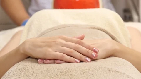 Woman lying on the table with the face completely covered with organic beauty Stock Footage