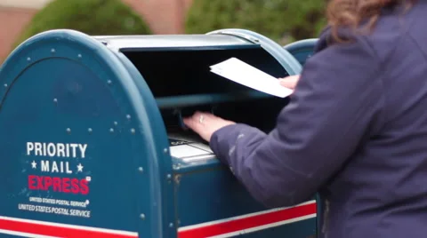 Woman Mailing Letter at Post Office Mailbox Stock Footage