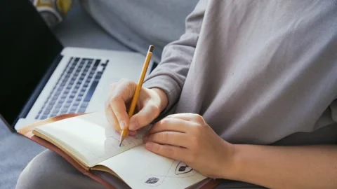 Woman make notes in paper diary Stock Footage 169012284