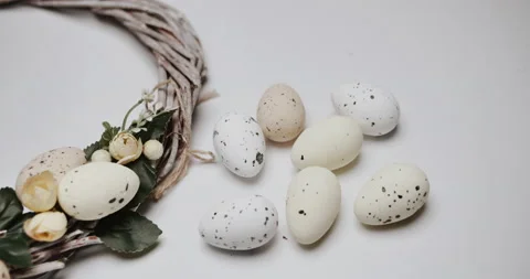 Woman makes Easter decoration in the form of an Easter wreath with eggs  Stock Footage 153275543