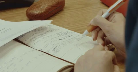 A woman makes an entry in the diary Video stock 64220660