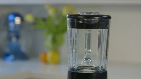 Woman makes fruit smoothy Stock Footage 22070050