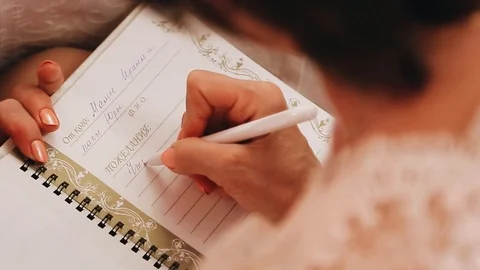 Woman makes notes in a notebook with a ballpoint pen Stock Footage 121245236