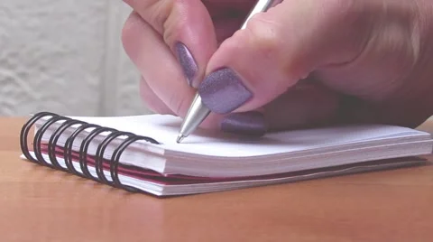Woman makes notes on a pad Stock Footage 52636198