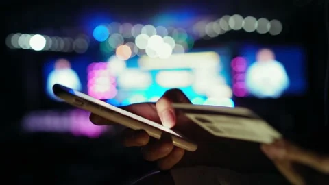 A woman makes a payment from a card using smartphone. On the background of Stock Footage 134147715