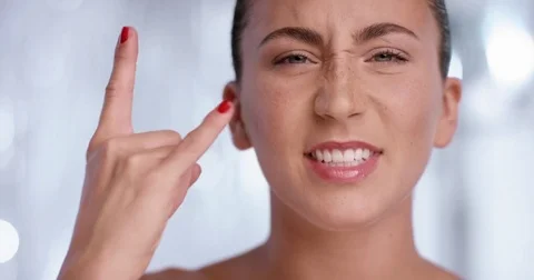 Woman makes the rockn roll gesture into the camera with a big smile Stock Footage