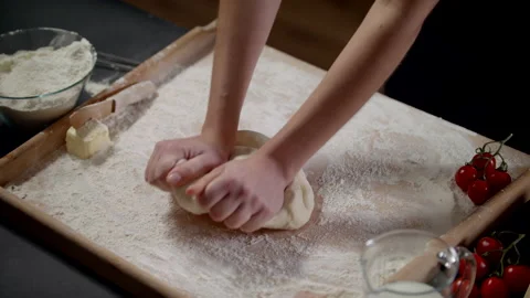 Woman Making Bread Using Traditional Recipe At Home On A Black Background Stock Footage 170240192