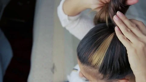 Woman is making a bun Stock Footage 74475129