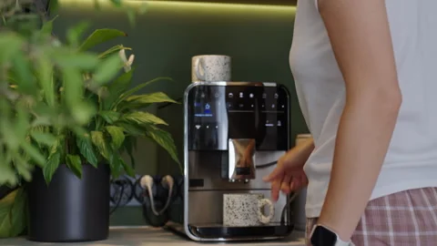 Woman making coffee with coffee machine at home coffee station Stock Footage 346003177