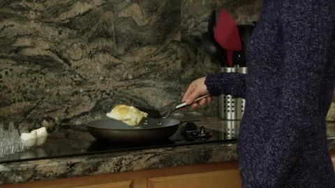 Woman making eggs Stock-Footage 69914725