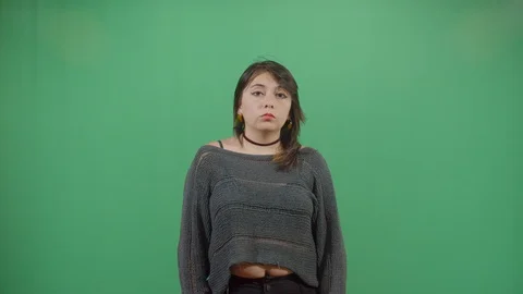 Woman making an expression of confusion with face and arms studio isolated shot Stock-Footage 117977611