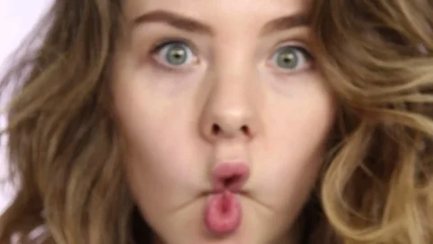 Woman making faces at camera Stock Footage 85177908