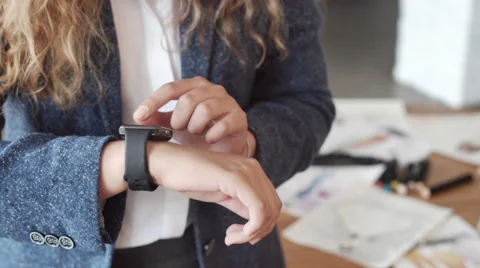 Woman making gestures on a wearable smartwatch computer device, smart watch. Stock Footage
