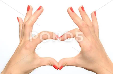 Woman making a heart gesture Stock Photos