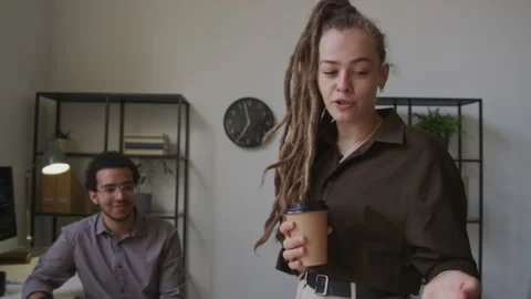 Woman Making HTML Code Presentation to Male Colleagues in Office Stock Footage 255783375