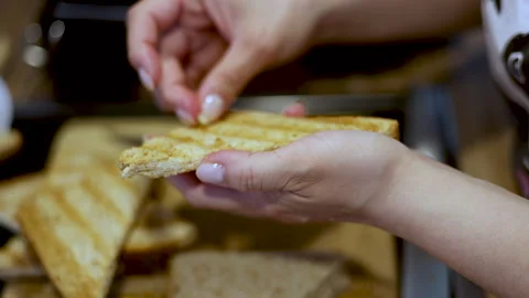 Woman making in kitchen bread in electric grill.toast Stock-Footage 242990872