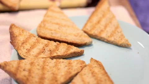 Woman making in kitchen bread in electric grill.toast 動画素材 242990902