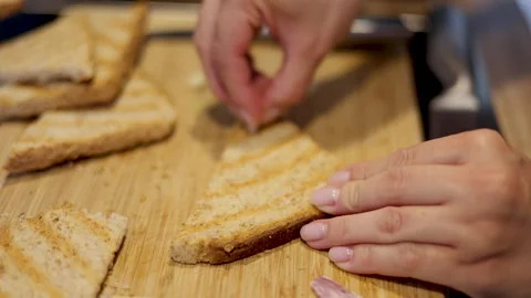 Woman making in kitchen bread in electric grill.toast Stock-Footage 242990906