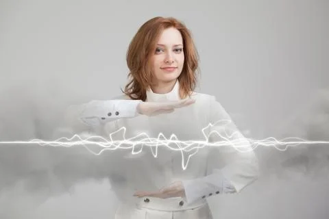 Woman making magic effect - flash lightning. The concept of electricity, high Stock Photos