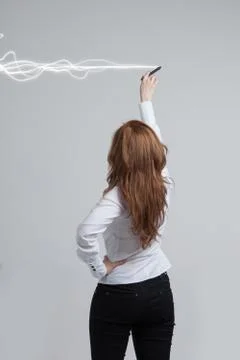 Woman making magic effect - flash lightning. The concept of electricity, high Stock Photos