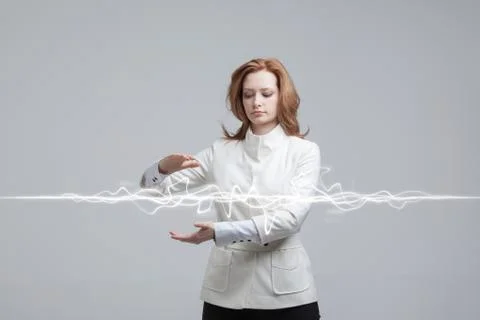 Woman making magic effect - flash lightning. The concept of electricity, high Stock Photos