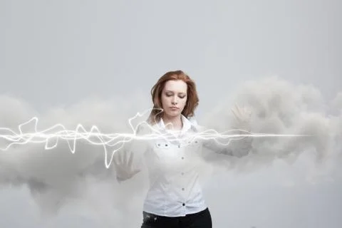 Woman making magic effect - flash lightning. The concept of electricity, high Stock Photos