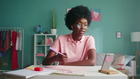 Woman Is Making Notes, Having Video Call Stock Footage 146817348