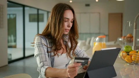 Woman making a payment using an iPad Pro Stock Footage 101490065