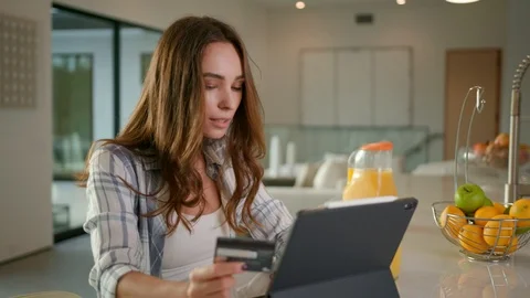 Woman making a payment using an iPad Pro  Stock Footage 101490128