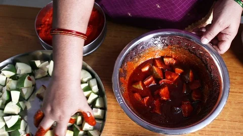Woman-making-raw-mango-pickle-at-home Stock Footage 108431823