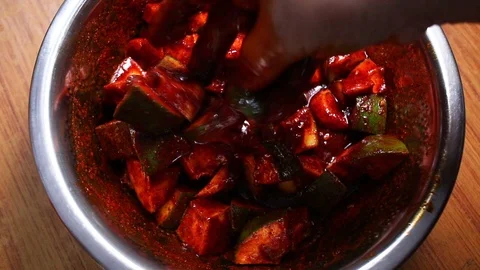Woman-making-raw-mango-pickle-at-home-2 Stock Footage 108441191