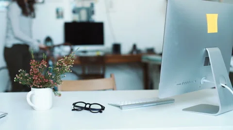 Woman making some notes at blueprints while leaning to the table in office Stock Footage 62765637