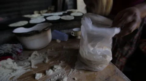 Woman making tortilla shells Stock Footage 61158091