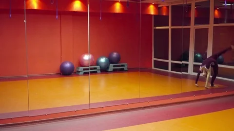 Woman making tricks in the dancing studio Stock Footage 75717122