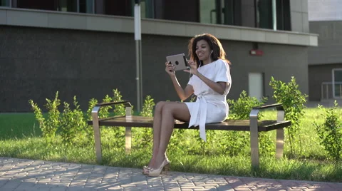 Woman making a video call via computer tablet Stock Footage 64777936