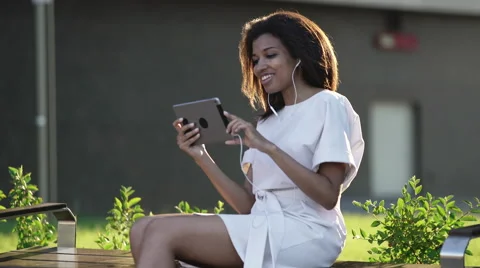 Woman making a video call via computer tablet Stock Footage 64778062