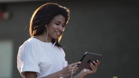Woman making a video call via computer tablet Stock Footage 64778085