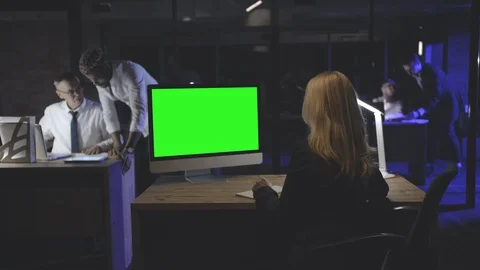 Woman manager working on desktop computer in dark office Stock Footage 125686148