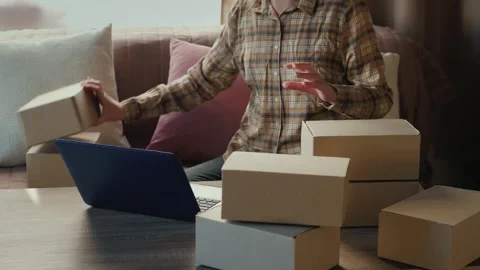Woman managing online e-commerce small business orders from home office. Video stock 334552365