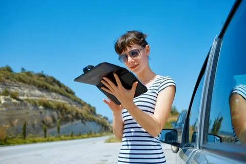 Woman with map Stock Photos