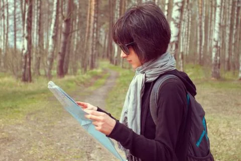 Woman with a map Stock Photos