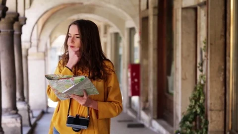 Woman with maps Stock Footage 106096153