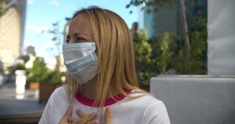 Woman with mask doing refusing hand gesture Stock Footage 139359331