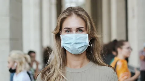 Woman in mask looking at camera closeup people coronavirus covid-19. Portrait. Stock Footage 142403053