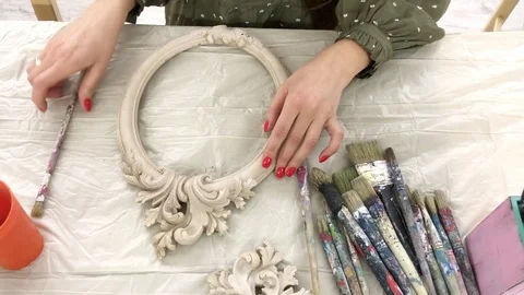 Woman at the master class in decorating the frame. Stock Footage 119695247